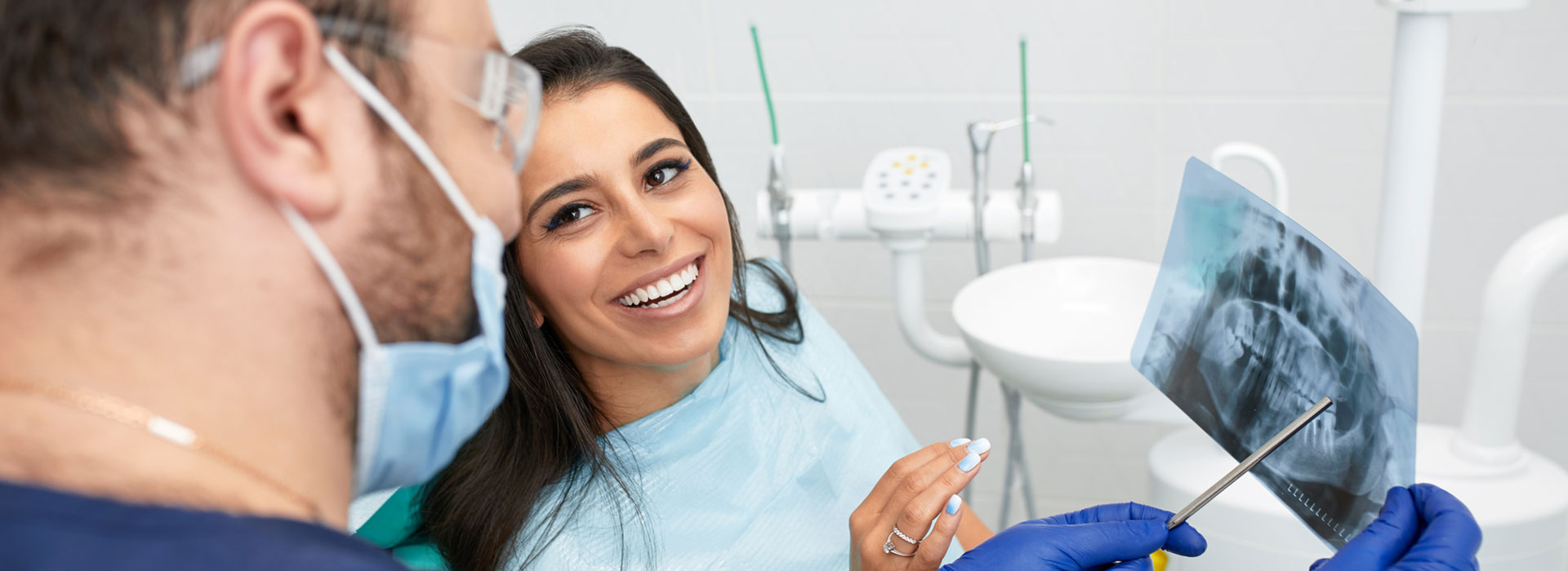 A beautiful woman is getting Composite tooth-colored fillings